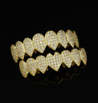 picture: heart-shaped pointed gold upper and lower teeth